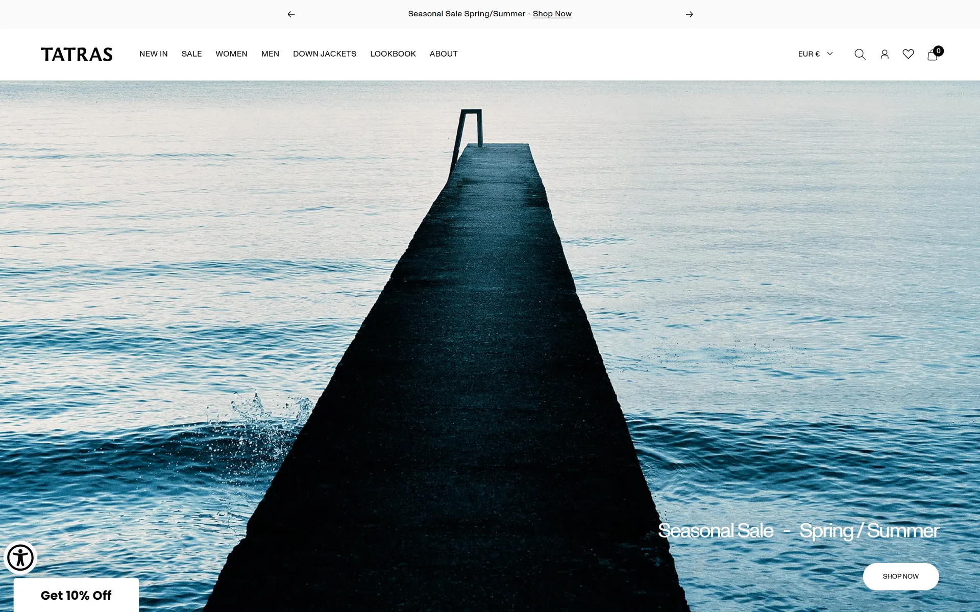 Tatras' homepage: a full-bleed cinematic image of a dark pier reaching into cool water, with the line 'Seasonal Sale — Spring / Summer' and a Shop Now button