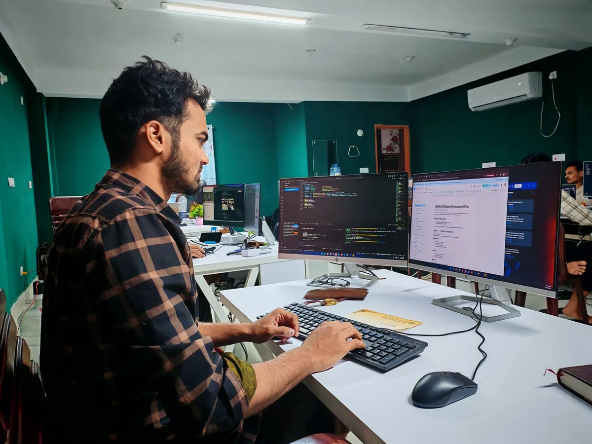 Developer building a website across two monitors - the engineering hours behind every website development quote