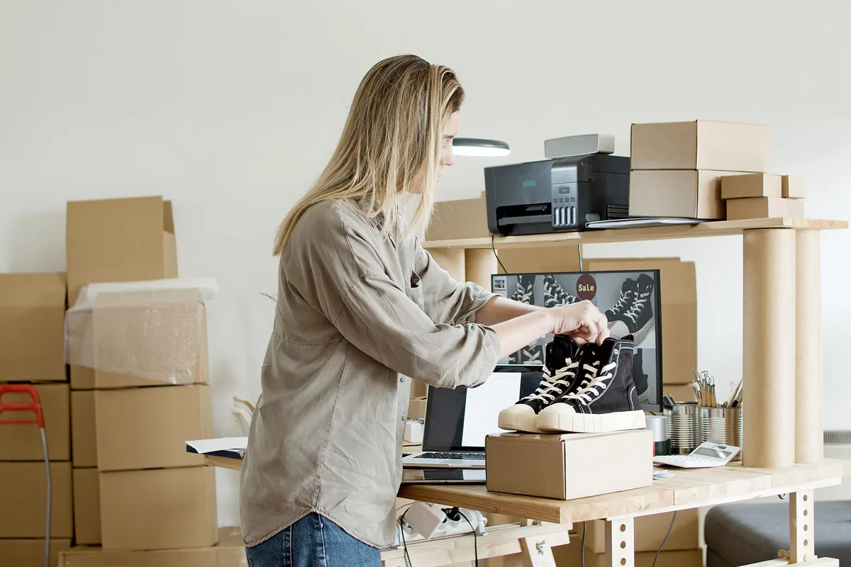 Store owner packing online orders - the operating reality an e-commerce website budget has to serve