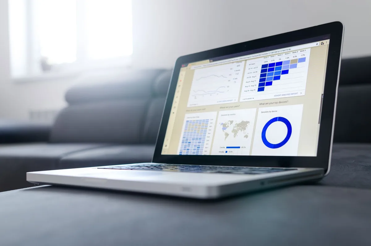 Analytics dashboard open on a laptop - the accounts, data, and workflows that make something a web app rather than a website