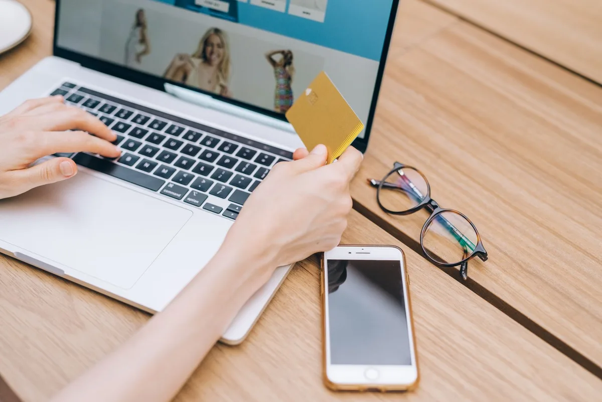 Customer completing a purchase on their phone - the mobile checkout experience an e-commerce website design lives or dies by