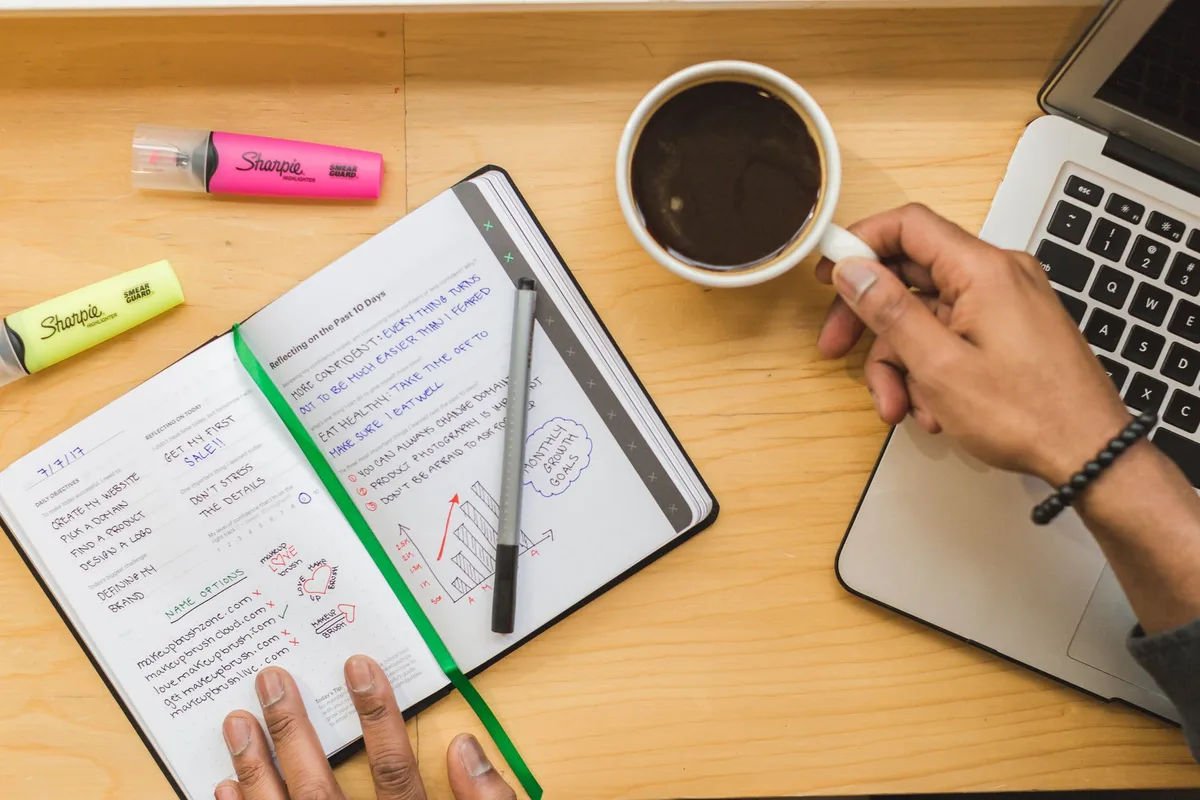 Writing website copy at a laptop - content is the phase that delays more website launches than design or development