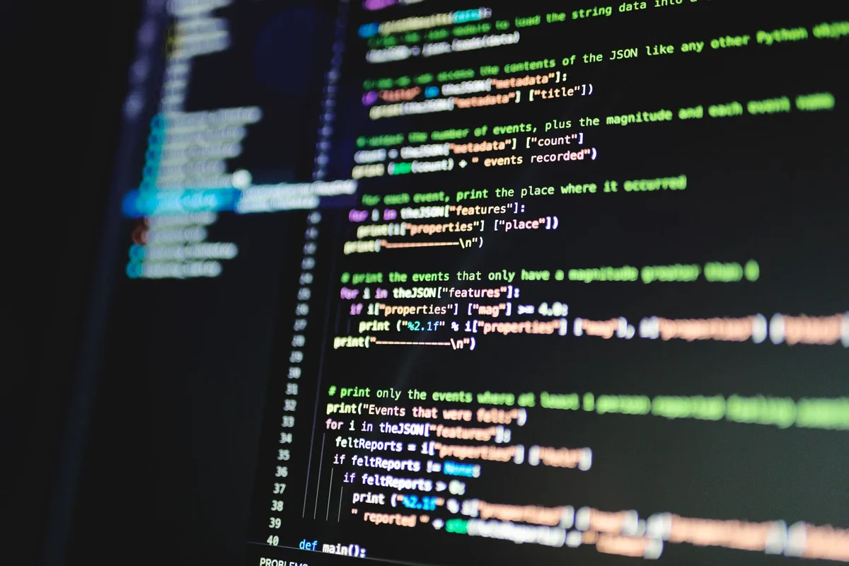 Developer reviewing code on screen - auditing a Perfex install for planted files and obfuscated code